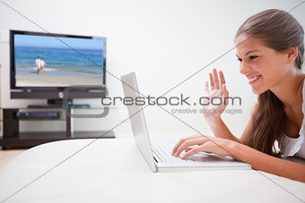 Woman doing video conference in the living room