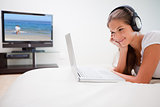 Woman listening to music on her laptop