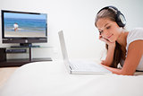 Woman enjoying music on her laptop