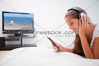 Woman enjoying music in the living room
