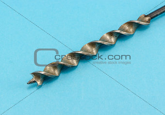 special wood drill bit on blue background 
