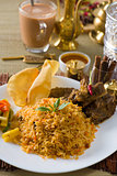 Biryani  rice with traditional items on background