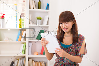 chinese female using a computer tablet 