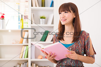 chinese girl reading on sofa lifestyle photo chinese girl readin
