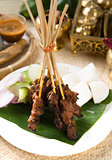 Asian Cuisine beef Satay with rice and traditional setup