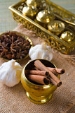 Cinnamon sticks and indian spices with traditional setup decorat