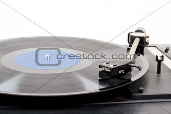 Spinning vinyl record. Motion blur image.  Vintage toned. 