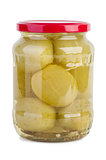 Glass jar with marinated green tomato