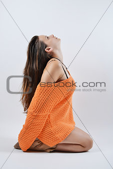 beautiful woman in orange sweater