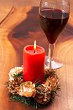 Christmas candle and a glass of wine
