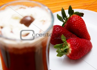 Cup of coffee with strawberries 