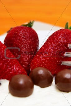 Strawberries and cream with chocolate balls 