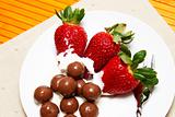 Strawberries and cream with chocolate balls 