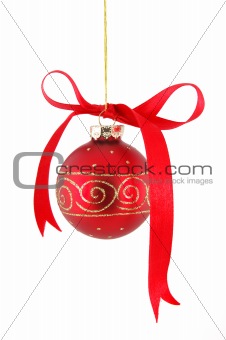 Ribbon on red christmas ball hanging over white