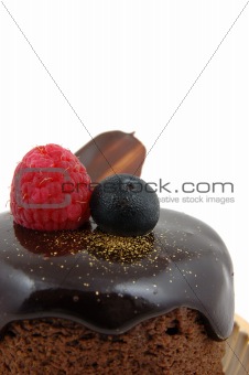 Chocolate cake with raspberry and blueberry topping