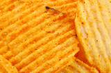Spicy potato chips background