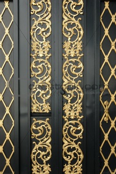 Black door with golden ornament