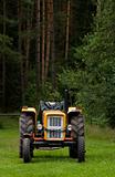 tractor on edge of forest