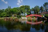 red bridge, blue sky and tree in the parks