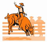 Rodeo cowboy riding a bull