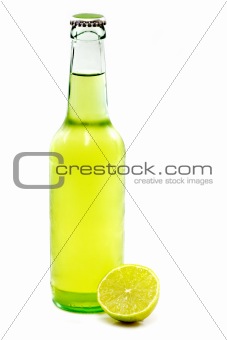 A bottle of beer with a lime 