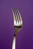 a fork against red background