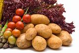 potatoes on vegetables background