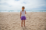 Young girl standing at beach