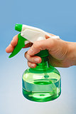 Hand holding water sprayer
