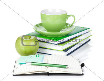 Ripe green apple, coffee cup and office supplies