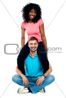 Girlfriend riding on her mans shoulder