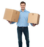 Portrait of a guy holding boxes