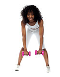 Fit woman exercising. Bending down