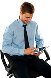 Businessman watching videos on tablet pc