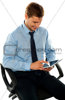 Businessman watching videos on tablet pc