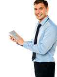 Businessman with electronic touch pad tablet