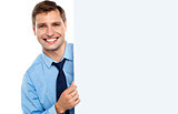 Business man holding a long blank banner ad