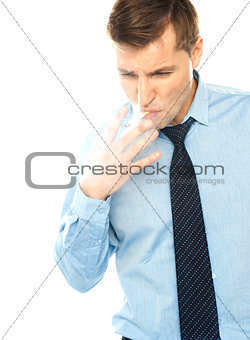 Young corporate male smokes a cigarette