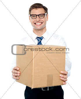 Businessman holding packed carton