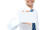 Cropped image of man showing business card