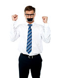 Angry young man with duct tape on his mouth