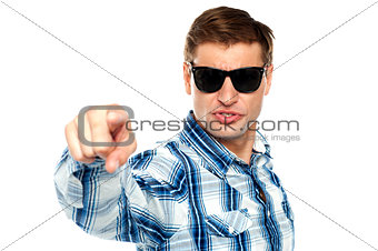 Cool fashionable guy pointing at you