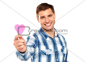 Man showing pink paper heart