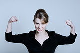 one strong powerful woman flexing muscles proud