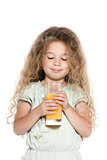 Little girl portrait orange juice drink