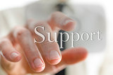 Male hand pointing at Support icon on a virtual screen