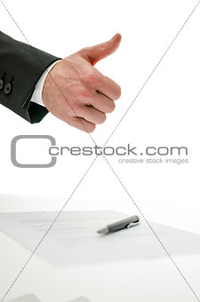 Thumbs up sign over a signed contract