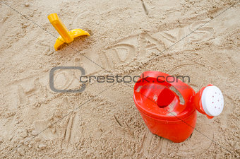 Wor holidays in sand with beach toys