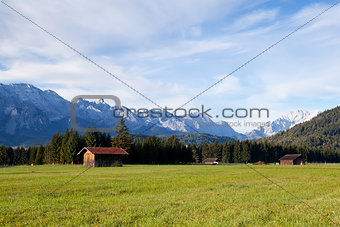 wooden hut on alpine meadows in morning