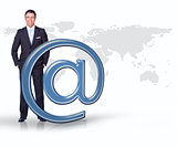 Businessman standing with blue email at symbol